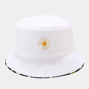 Close-up of white cotton bucket hat with daisy embroidery and floral inner brim detail