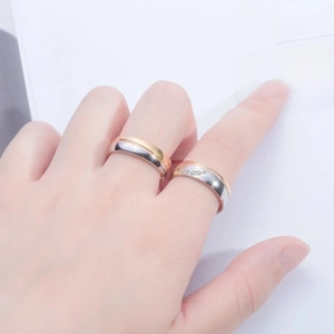 Three-tone gold and silver stainless steel couple ring with small diamond accents