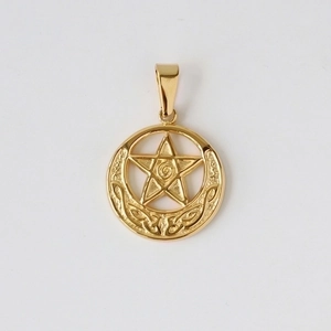 Macro shot of gold-plated celestial pendant featuring a star and crescent moon design