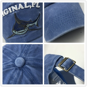 Vintage washed navy cotton baseball cap featuring detailed shark embroidery and metal buckle