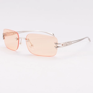 Lunettes de soleil Y2K sans monture avec verres orange et étoiles en métal argenté