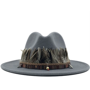 Grey wide brim wool fedora hat featuring ethnic bands and natural feather decoration