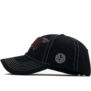 Detail of USA embroidery and white contrast stitching on black cotton baseball cap