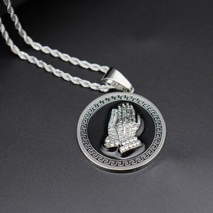 Silver hip hop necklace with black prayer hands pendant and crystal details on twist chain