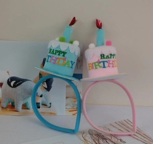 Pink and blue birthday cake headbands with Happy Birthday embroidery and candle detail