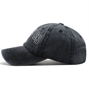 Washed cotton baseball cap in dark grey with white 66 embroidery on the side profile