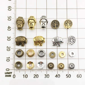 Assorted alloy spacer beads with elephant and Buddha motifs in gold silver and bronze