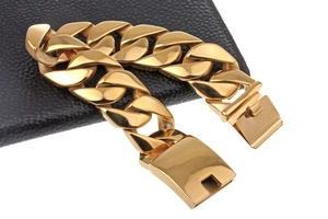 Close-up of 18k gold plated stainless steel Cuban link bracelet with secure folding clasp
