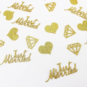 Golden glitter confetti set with Just Married letters heart and ring shapes for wedding decor