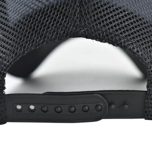 Detail of adjustable black snapback closure and mesh texture on a cotton trucker hat