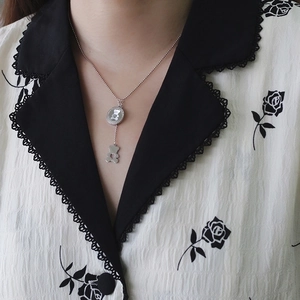 Silver bear pendant necklace with double charms on a polished stainless steel chain