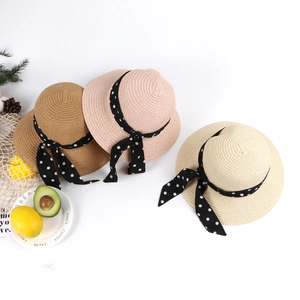 Three colors of straw sun hats for women and children with polka dot ribbon bows