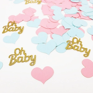 Pink and blue heart confetti with gold glitter Oh Baby cutouts for gender reveal parties