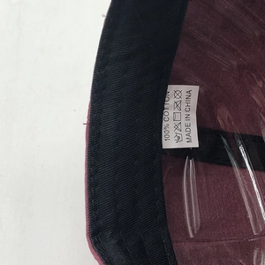 Detail shot of the internal washing label on the 100% cotton washed baseball cap