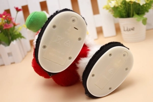 Detail of the electric Santa Claus toy base showing battery compartment and power switch