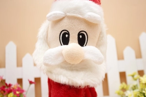 Close-up of plush Santa Claus face and soft white beard with warm festive holiday lighting
