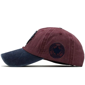 Close-up of side embroidery with Canada text and maple leaf on washed cotton cap
