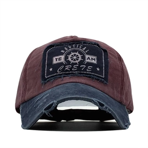 Vintage washed cotton baseball cap with distressed brim and nautical team patch embroidery