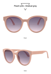 Macro detail of peach pink cat eye sunglasses with metal rivets and textured temples