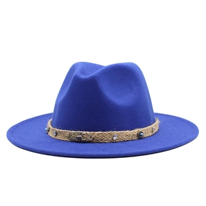 Detail of wool fedora with woven band, blue beads, and bronze scorpion ornament