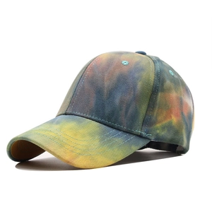 Close-up of the colorful tie-dye baseball cap featuring a reinforced curved brim and stitching