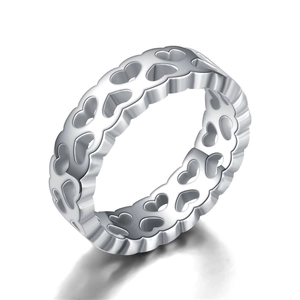 Polished silver stainless steel openwork heart pattern ring for couples on white background