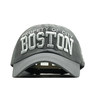 Close-up of gray baseball cap featuring 3D embroidered Boston lettering and premium stitching