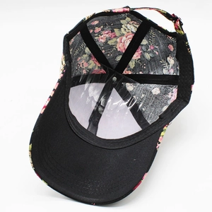 Detail view of cotton baseball cap interior featuring rose print and adjustable strap