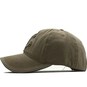 Macro side view of brown washed cotton baseball cap featuring vintage 3D anchor embroidery