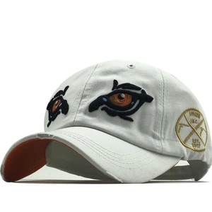 Beige baseball cap with vintage frayed brim and eye embroidery for outdoor sun protection