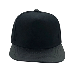 Black cotton snapback cap with embossed snakeskin pattern on a flat brim for streetwear