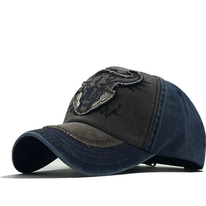 Vintage washed baseball cap with bull skull embroidery and distressed brim detail