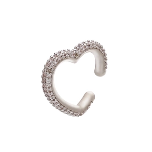 Macro shot of silver heart ear cuff with micro-pave cubic zirconia on white background