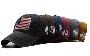 Detail of six washed cotton baseball caps with USA flag embroidery and side patches