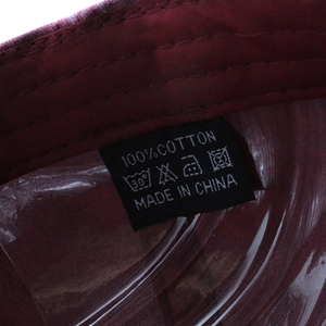 Macro view of 100% cotton wash label and internal stitching on the baseball cap