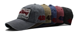 Multiple colors of washed cotton baseball caps with vintage embroidery and patches