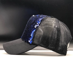 Detail of glitter baseball cap with dark blue sequins and breathable black mesh fabric