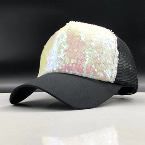 Close-up of holographic sequins and breathable black mesh detail on a girls' baseball cap