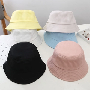 Detailed top view of assorted cotton bucket hats in six macaron colors with soft textures