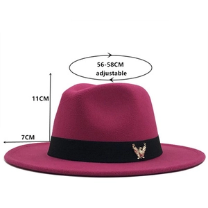 Detail of rose red fedora hat showing 7cm brim, 11cm height, and eagle emblem