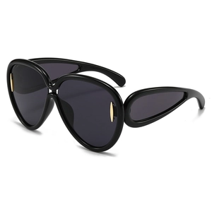 Lunettes de soleil oversize noires avec accents métalliques ovales dorés de luxe