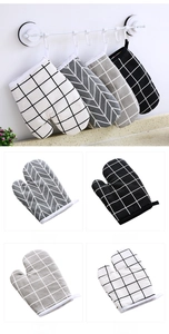 Detail view of thickened heat-resistant oven mitts with geometric patterns and hanging loops