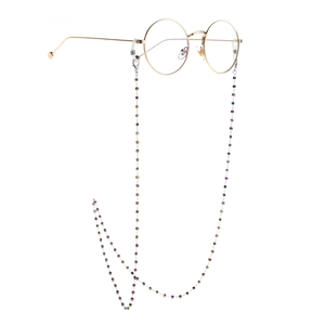 Stainless steel eyewear chain with colorful square crystals on a gold thin-frame glasses
