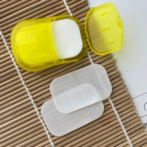 Macro shot of portable yellow soap sheet container with white soluble paper soaps