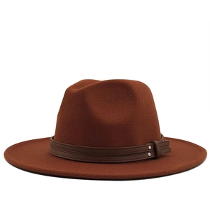 Close-up of rust red wool felt wide brim hat with leather band and metal rivets