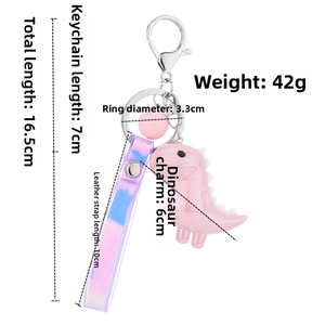 Pink cartoon dinosaur keychain with gradient purple strap and precise dimensions shown