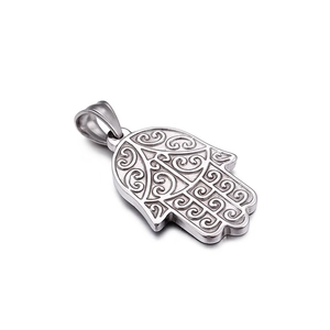 Silver Hamsa palm pendant in stainless steel with intricate scroll engraving on white background