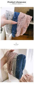 Detail of wide knitted lace headband with breathable mesh texture and colorful speckles