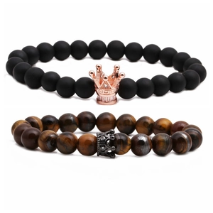 Tiger eye and matte black stone beaded crown bracelets for couples on white background