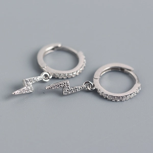 Close-up of S925 sterling silver huggie earrings with sparkling lightning bolt pendants